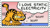 Garfield the cartoon cat thinking 'I love static electricity' while scuffling his feet on a carpet.